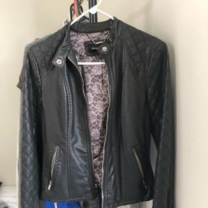 A Black Rivet Grey leather jacket